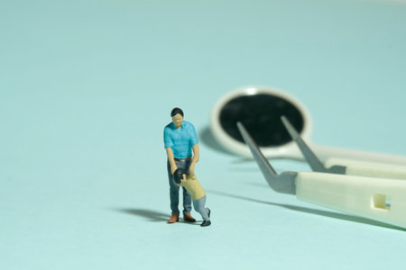 Miniature people toy figure photography. Refusing to checking teeth concept. A father and son...