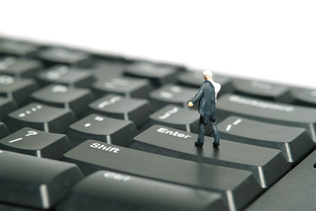 Miniature tiny people toy figure photography. A businessman getting ready wearing suit standing...