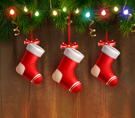 Three red christmas stockings hanging on fir twig at wooden wall background realistic vector Illustrationのイラスト素材