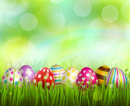 Colorful painted easter eggs on green grass on blurred background with bokeh realistic vector illustrationのイラスト素材