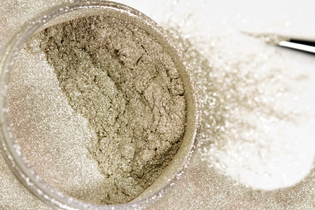 Grey silver nail polish glitter close up on white background. Metal shine .の写真素材