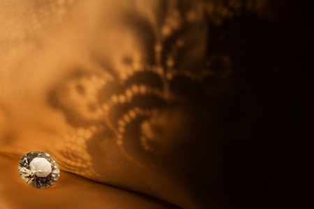 Amazing diamond on vintage dark  pattern background with soft light.の写真素材