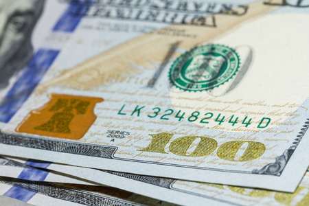 One hundred dollar bills close up with selective focus 
