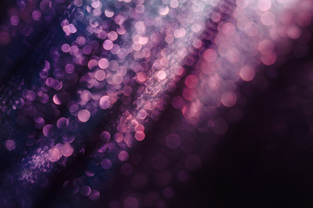 Glitter and glow soft multi colored bokeh shining . Dark abstract dreamy wunderful sparkle background.の写真素材