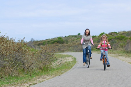 Mother with children on their bikesの写真素材