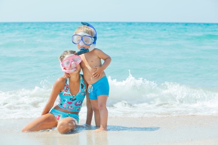 Happy Divers On A Beach