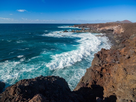 View through rocks on coastlineの写真素材
