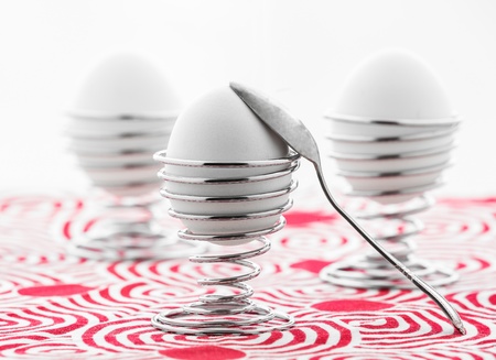 eggs in metal stands