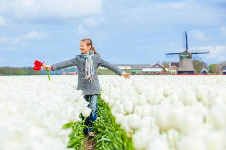 Girl in the purple tulips fieldの写真素材