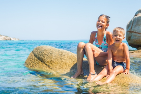 Kids playing in the seaの写真素材