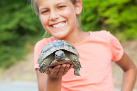 young girl and turtleの写真素材