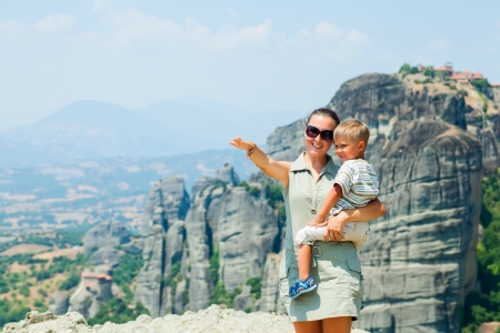 Mother and son looking at the town of Kalambaka bird s eye view  Meteora, Greece の写真素材