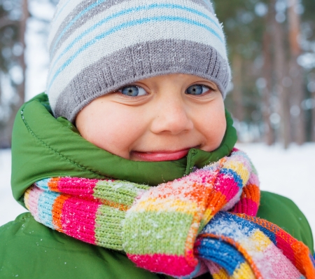 Portrait of a little baby boy in winter forest の写真素材