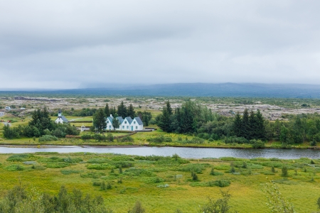 Scenic valley and a village in Thingvellir National Park - famous area in Iceland の写真素材