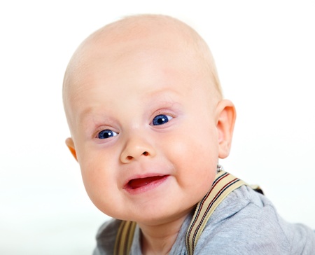 Closeup portrait of cute baby boy on white background の写真素材
