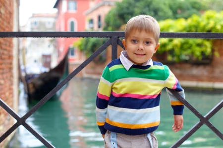 Summer venetian view and tourist boy  Venice, Italy の写真素材