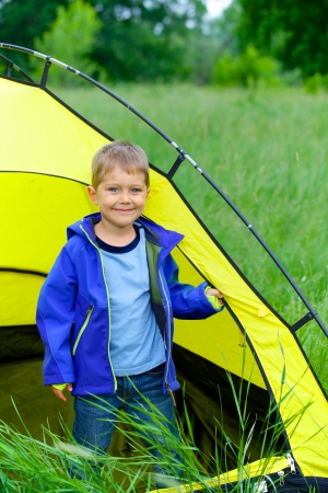 Cute little boy camping with tent outdoor の写真素材