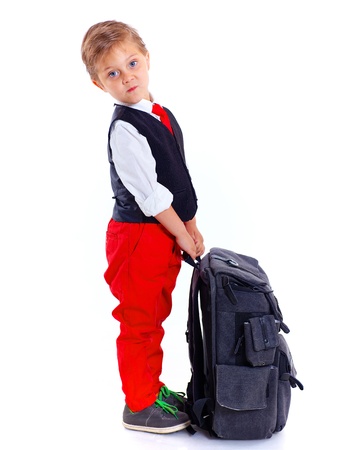 Happy schoolboy with backpack isolated on white backgroundの写真素材