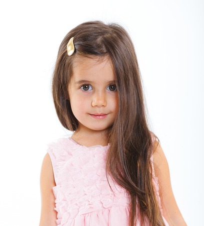 Beautiful little girl happy smiling on studio  Isolated white backgroundの写真素材
