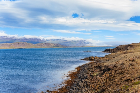 Cloudy sky over the coast in the East Fjords Iceland の写真素材