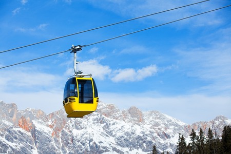 Cable car on the ski resort in Austria  On the background blue sky の写真素材