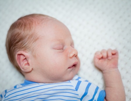 Portrait sleeping baby boy  11 days young baby の写真素材