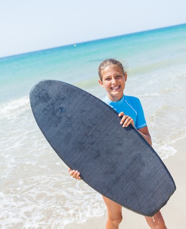 Teenage girl surfing