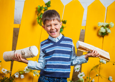 Boy with pile of firewood