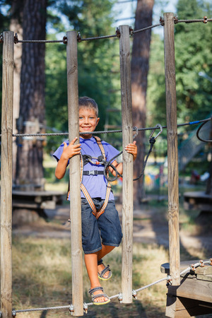 Boy in a climbing adventure parkの写真素材