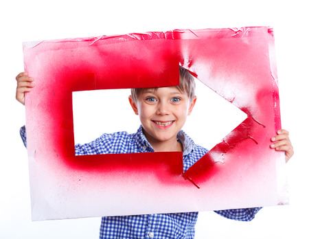 Cute boy holding red arrowの写真素材