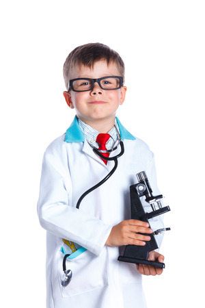 Little smiling doctor with stethoscope and microscope.. Isolated on white backgroundの写真素材