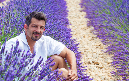 Young man admiring the lavander fields in Valensole. Provence, France.の写真素材