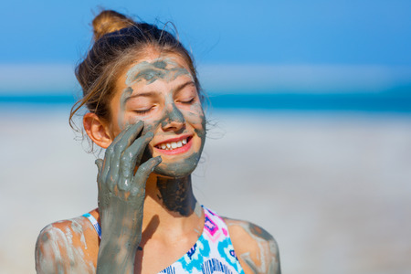 Portrait of beautiful girl taking Mud SPA At The Dead Sea, Israel.の写真素材