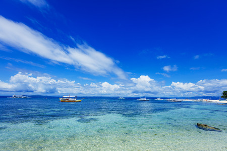 Sailboats in blue sea. Tropical Island in the Philippines.の写真素材