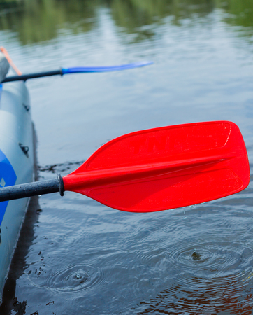 Red paddle for white water rafting and kayakingの写真素材