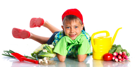Cute preschool boy gardener. Isolated on the white backgroundの写真素材