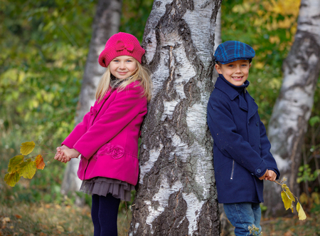 Happy Kids walking in beauty Autumn Parkの写真素材