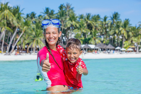 Photo of happy snorkeling kids in pink swimwearの写真素材