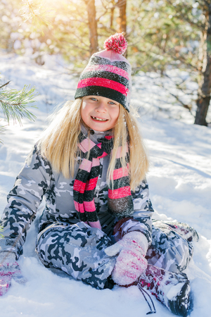 Girl playing in big snow in winter.の写真素材