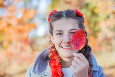 Beautiful young girl - colorful autumn portraitの写真素材
