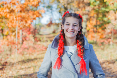 Beautiful young girl - colorful autumn portraitの写真素材