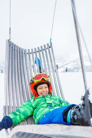 Skier boy in a winter ski resort.の写真素材
