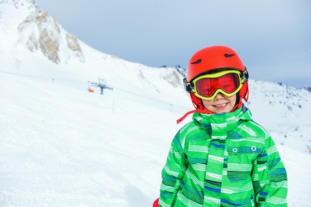 Skier boy in a winter ski resort.の写真素材