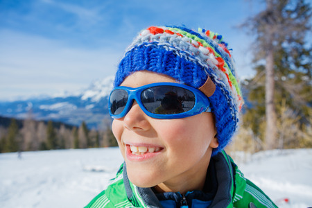Skier boy in a winter ski resort.の写真素材