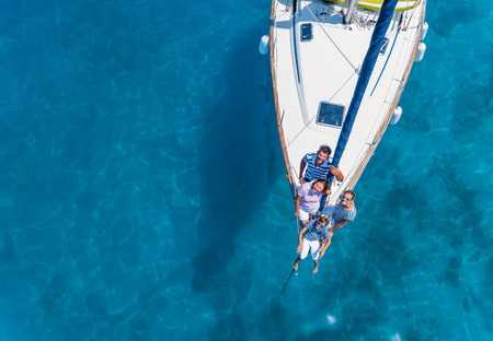 Aerial view of Family with adorable kids resting on yachtの写真素材