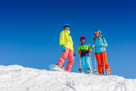 Happy family enjoying winter vacations in mountains . Ski, Sun, Snow and fun.の写真素材