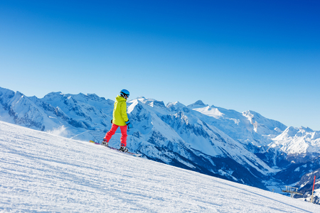 Girl snowboarder having fun in the winter ski resort.の写真素材