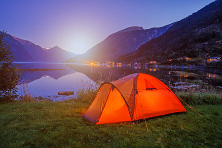 Norwegian fjord landscape with camping tent. Norway adventure.の写真素材