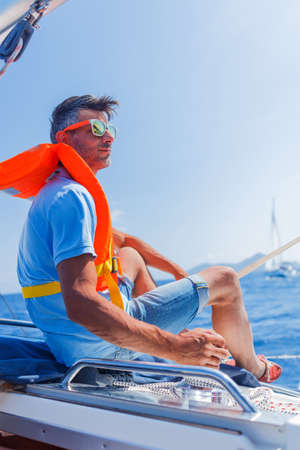 Handsome Man resting On Yacht in Greeceの写真素材