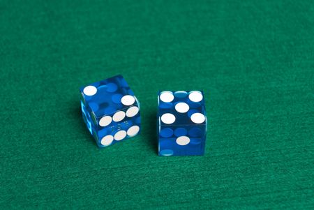 Blue Casino Dice on green felt showing Seven